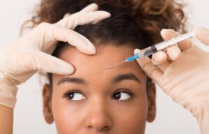 Young woman having Botox injections for the first time